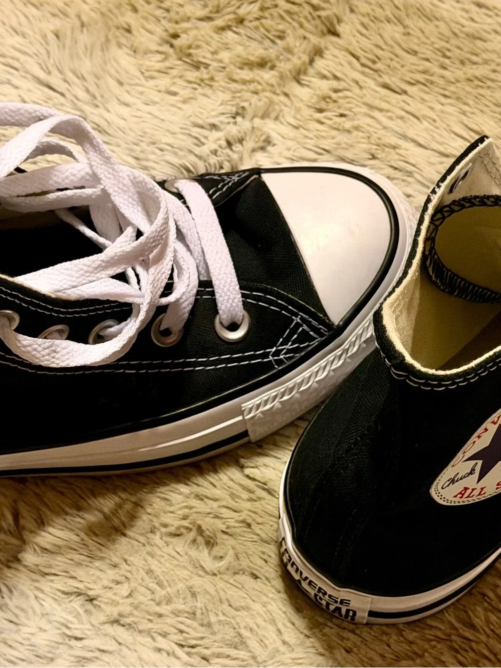 Converse women’s Chuck Taylor’s Black High Top Sneakers with Navy Star Logo